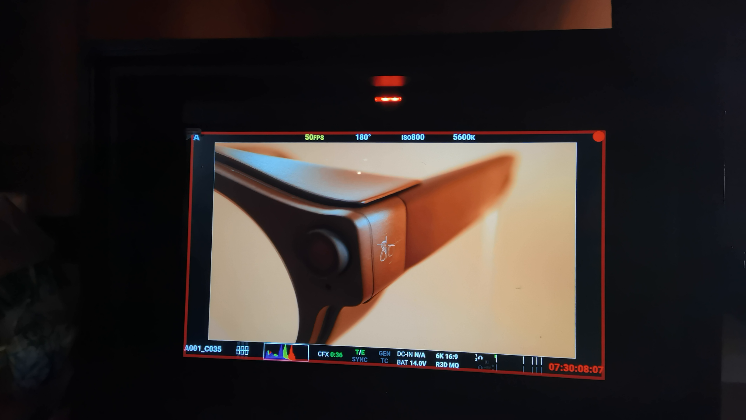 Production monitor showing the round side module and 8ight branding on the camera glasses