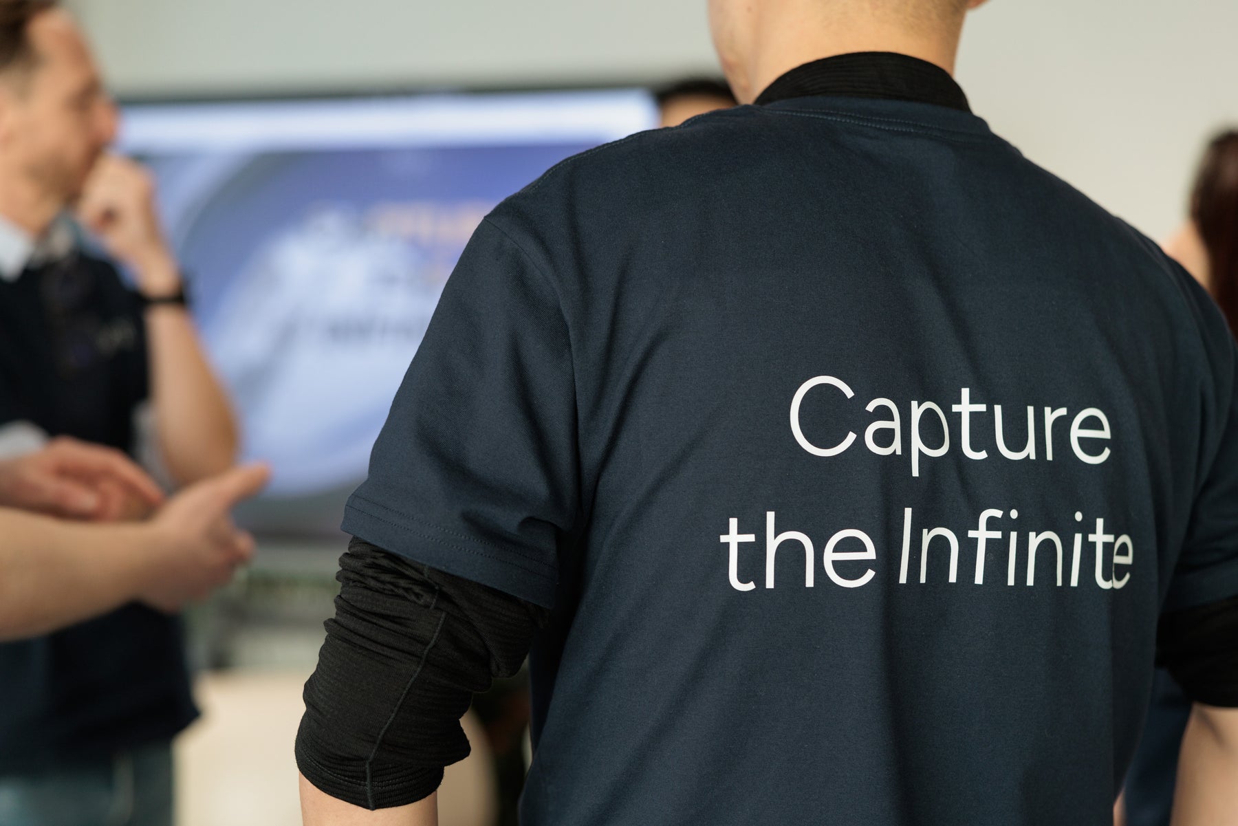 Capture the Infinite message printed on an 8ight team shirt