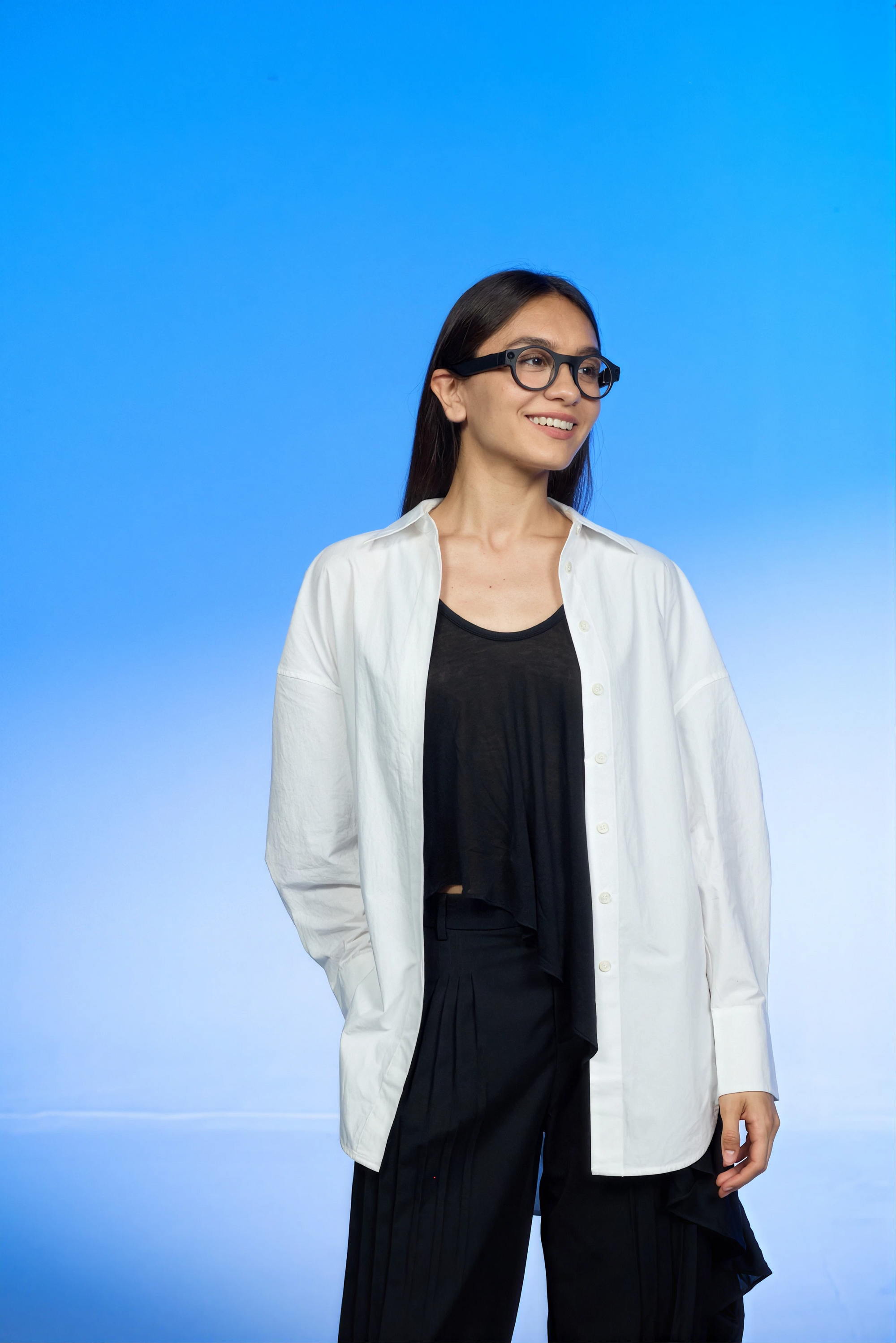 Person wearing 8ight Pro smart glasses with clear lenses